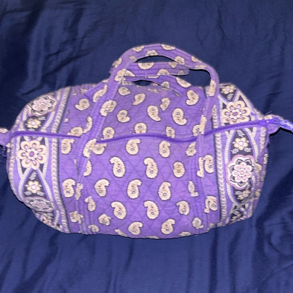 Vera Bradley duffle bag purple with a few flower designs. Lightly used!